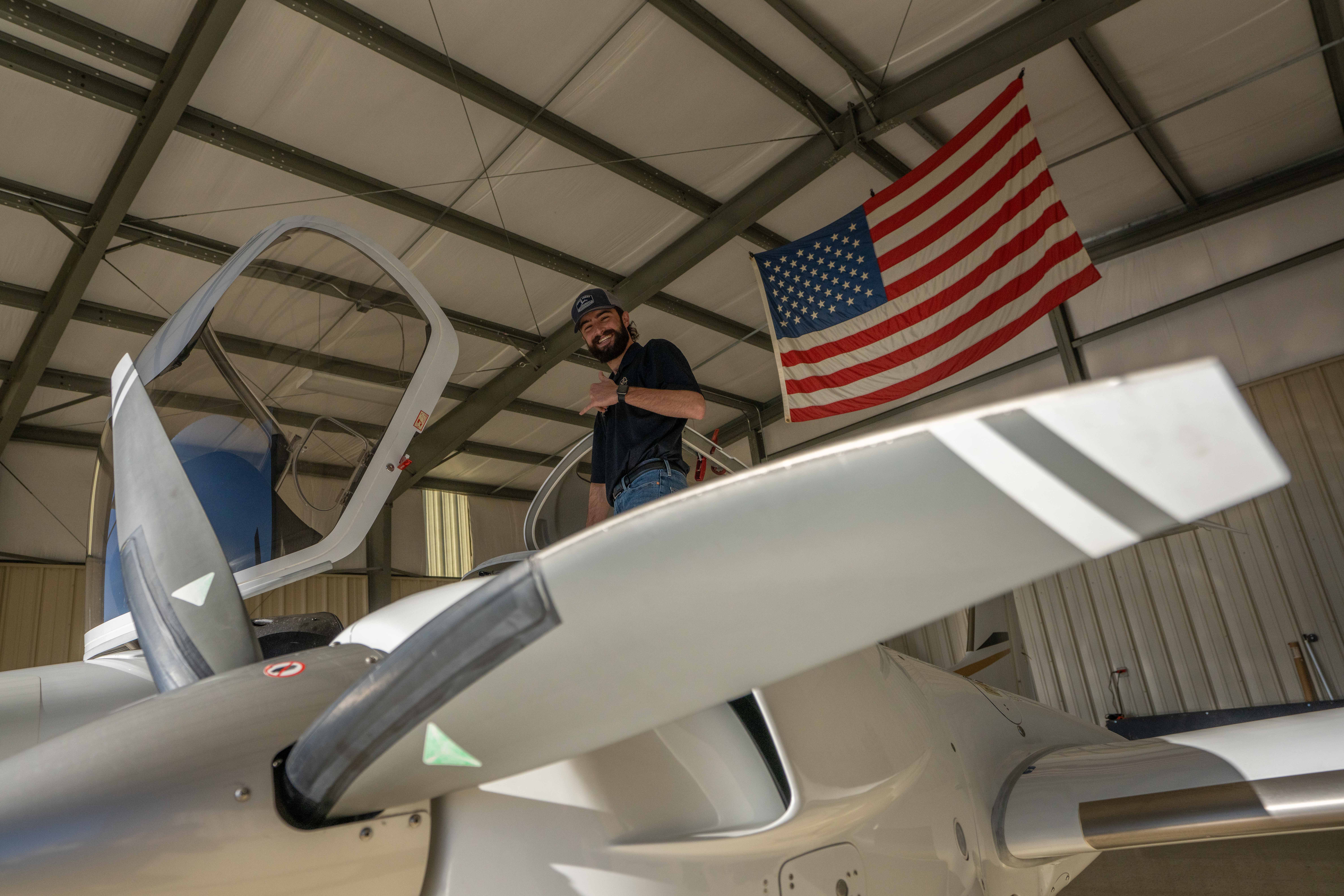 Buddy King at Falcon Field, climbing into the DA42