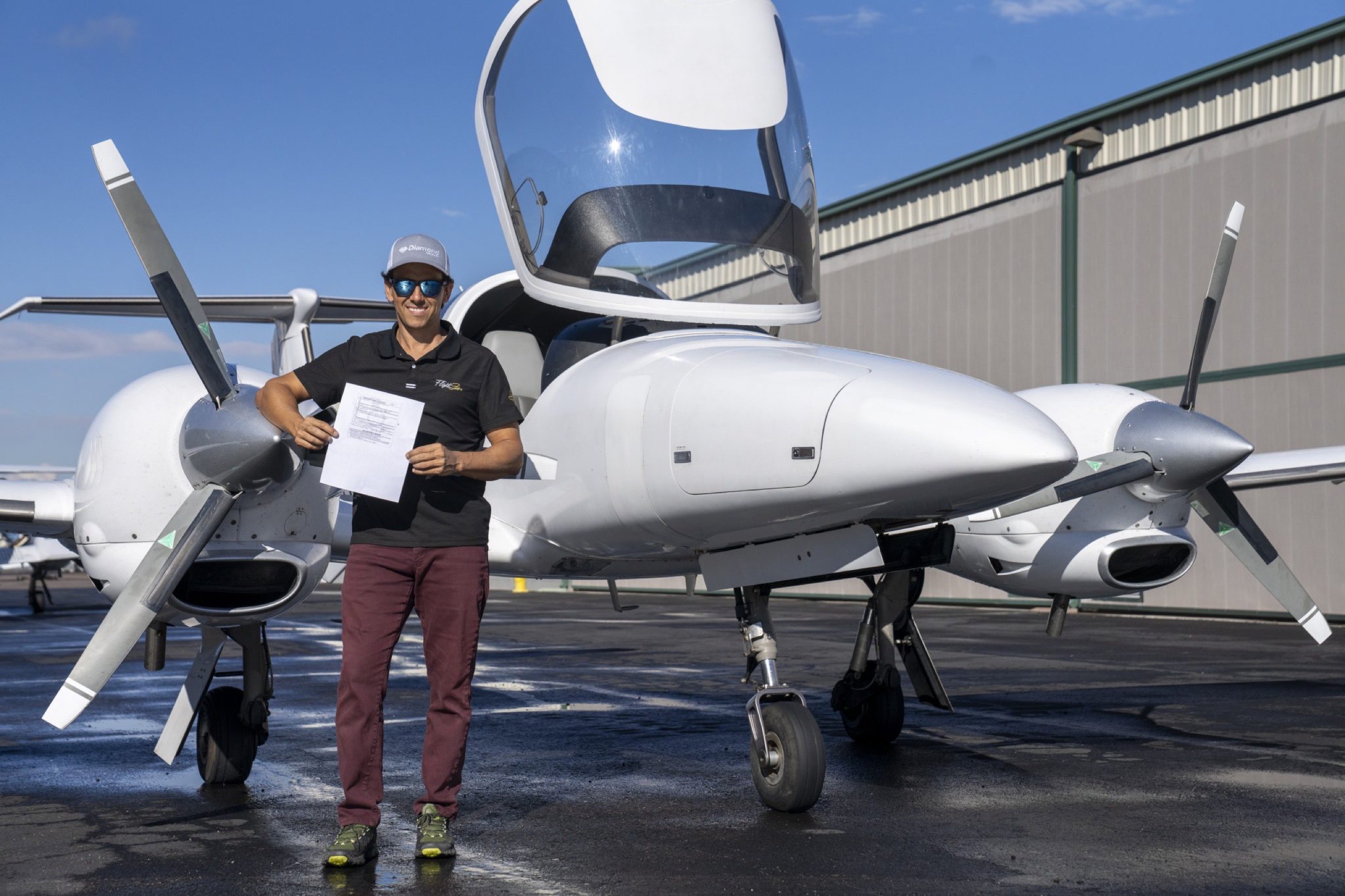 Gustavo with his commercial multiengine certificate, Diamond DA42 at Flight Stars